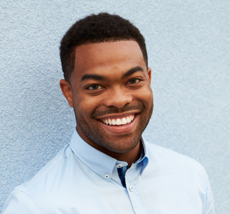 Young man smiling outdoors